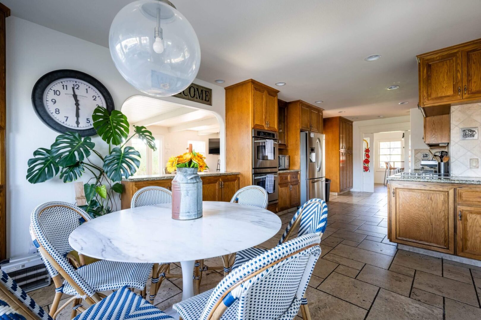 A kitchen with a table and chairs in it