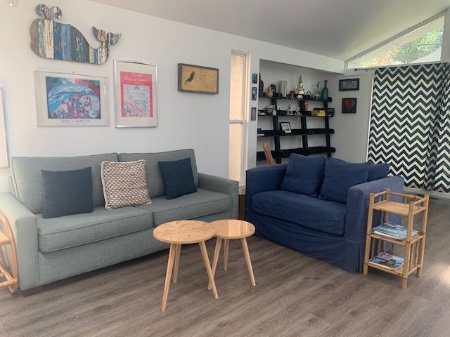 A living room with two couches and a table